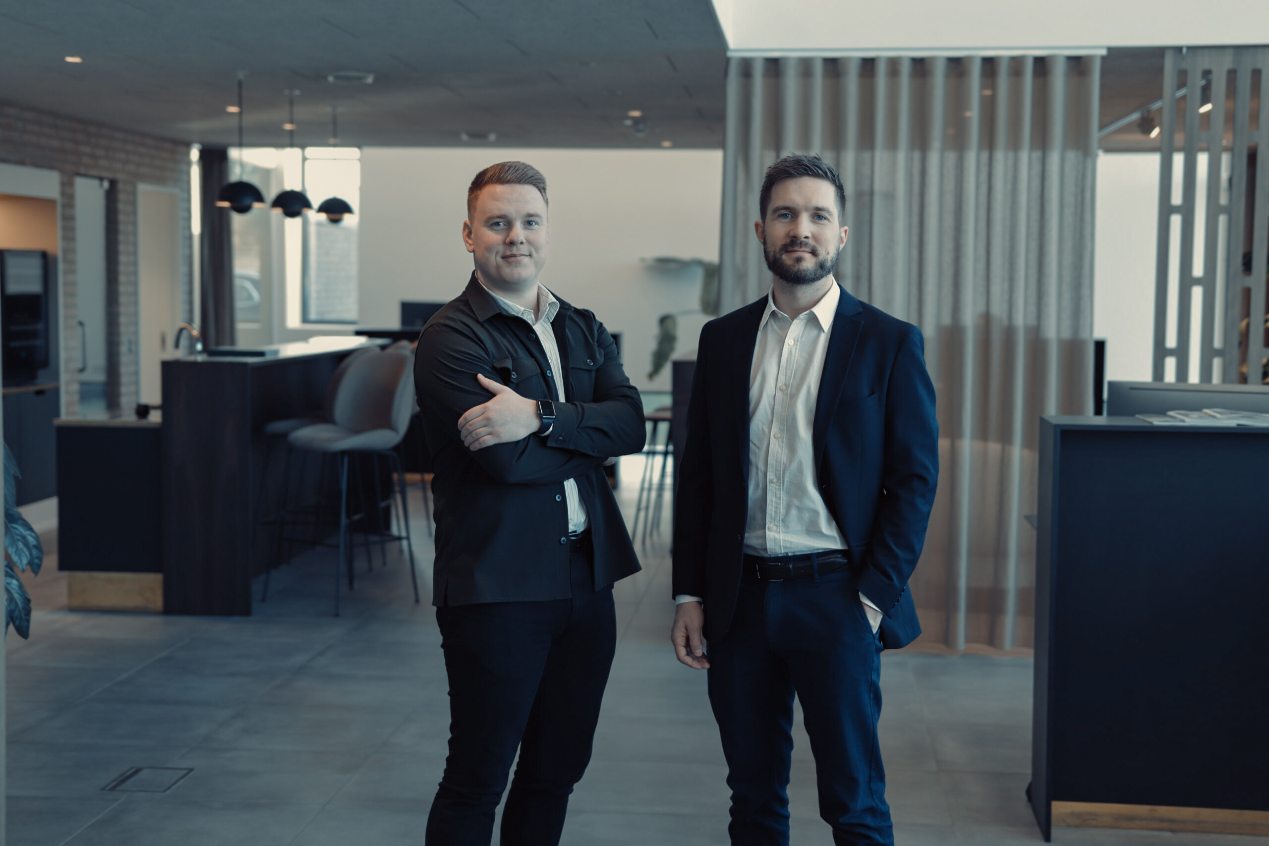 two men standing in a room