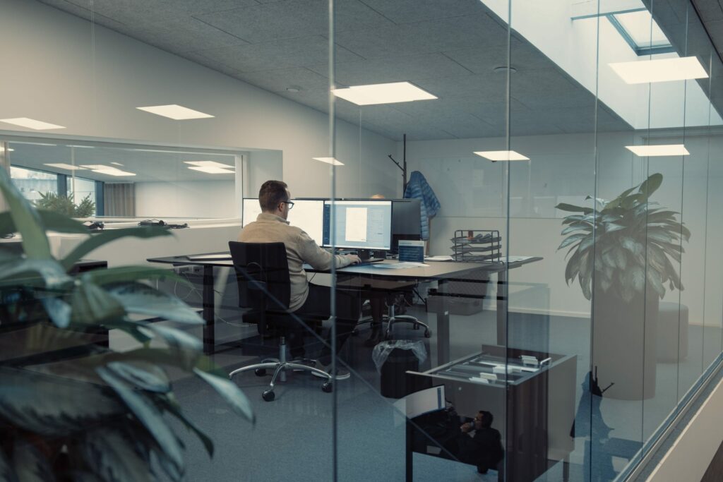 a man sitting at a desk with a computer