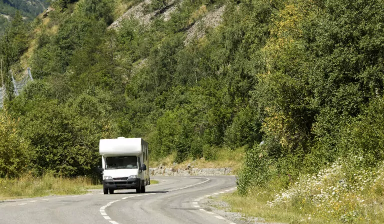 a white rv on a road